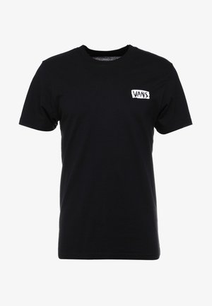 T-shirt noir à manches courtes et col rond avec un petit logo rectangulaire blanc Vans sur le côté gauche de la poitrine.