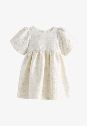 Babykleid in Cremeton mit Puffärmeln, floraler Jacquard-Struktur und dezent erhabenem Tupfenmuster.
