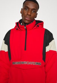 DC Shoes TRANSITION REVERSIBLE ANORAK - Casaco de snowboard - racing red