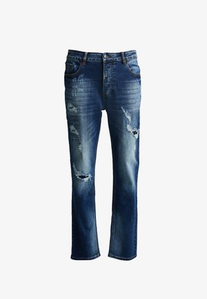 Sininen farkkuhousut, joissa on kulutettuja yksityiskohtia, sisältäen repeytyneitä alueita ja haalistumisia. Suunnittelussa on klassinen viiden taskun tyyli ja suorat lahkeet.