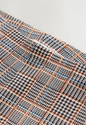 Woven fabric featuring a check pattern in beige, brown, blue, and black colors. Soft texture with a subtle sheen and contrasting lines.