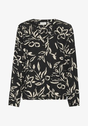 Blouse noire à manches longues avec un col en V, dotée d'un motif floral blanc et d'un tissu léger. Comprend des poignets élastiques et un ourlet droit.