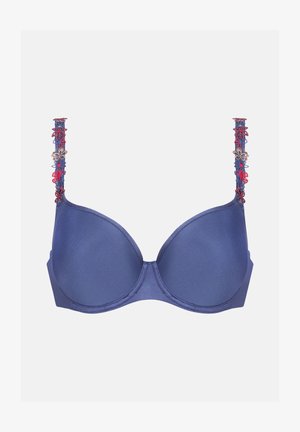 Reggiseno blu navy con coppe lisce e imbottite; spalline elaborate con ricami floreali in rosso, blu e oro; dettaglio di chiusura posteriore non visibile.