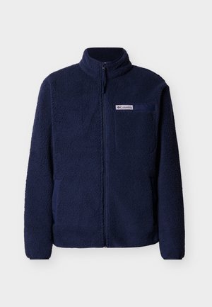 Tumši zils pilnībā rāvējslēdzēja flīsa džemperis ar augstu apkakli un krūšu kabatu, kurā ir Columbia zīmola etiķete.