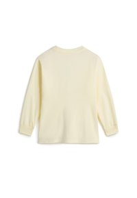 Camisa de manga larga en suave algodón amarillo pálido. Presenta un escote redondo, puños acanalados y una textura suave. La vista trasera no muestra ningún detalle gráfico.