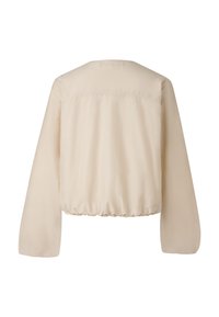 Krótka beżowa kurtka bomberka z długimi rękawami, elastycznym dołem, gładką tkaniną i minimalistycznym designem, z prostym okrągłym dekoltem.