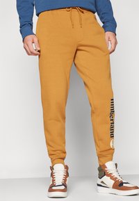 Timberland KENNEBEC RIVER BRUSHED BACK - Träningsbyxor - wheat boot