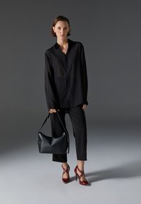 Bolso de mano - black