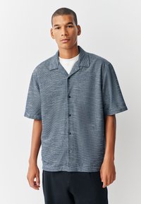 Korte mouwen overhemd met knopen in blauwe gestructureerde stof met een kraag, voorzien van een regular fit en knoopsluiting aan de voorkant.