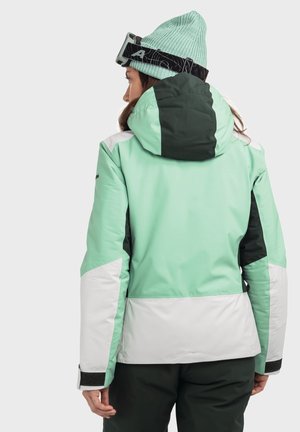 Minzgrüne Skijacke mit weißen und dunkelgrünen Akzenten, ausgestattet mit Kapuze, verstellbaren Bündchen und einer glatten, wasserdichten Textur.