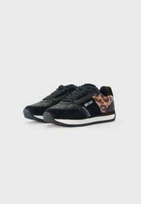 Black sneakers with glittery toe caps, leopard print sides, black laces, and white soles, branded with "Just Cavalli" on the sides.