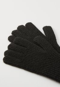 Gants noirs côtelés en tissu épais, avec cinq sections pour les doigts et une texture douce. Pas de logos ou d'accents visibles.