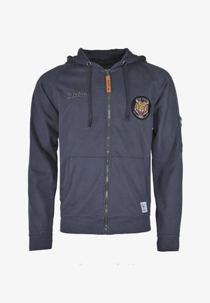 Marineblauwe hoodie met rits, gemaakt van zachte stof, voorzien van een trekkoordenkap, voorzakken en een geborduurd tijgerembleem op de linkerkant van de borst.