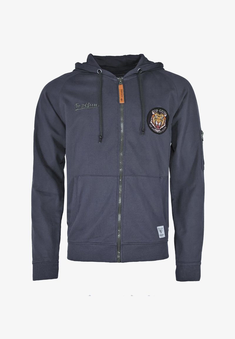 Marineblauwe hoodie met rits, gemaakt van zachte stof, voorzien van een trekkoordenkap, voorzakken en een geborduurd tijgerembleem op de linkerkant van de borst.