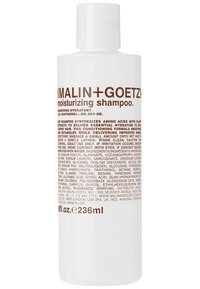 Bottiglia di plastica bianca contenente shampoo idratante, con testo marrone. Capacità di 236 ml. L'etichetta elenca gli ingredienti e le istruzioni per l'uso.