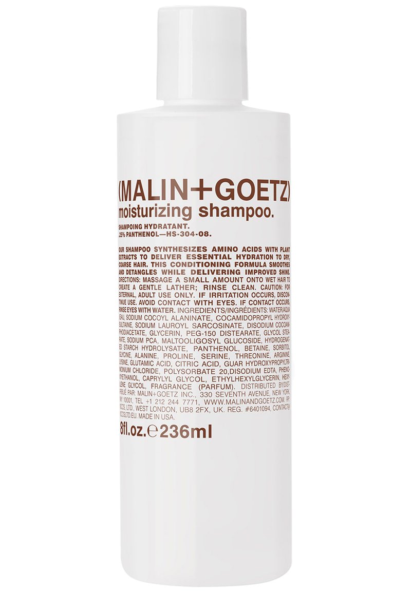 Bottiglia di plastica bianca contenente shampoo idratante, con testo marrone. Capacità di 236 ml. L'etichetta elenca gli ingredienti e le istruzioni per l'uso.