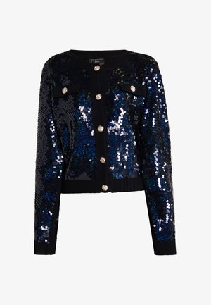 Czarny kardigan z cekinami, charakteryzujący się krótkim krojem, okrągłym dekoltem, długimi rękawami oraz błyszczącymi zapięciami na guziki. Dwie ozdobne kieszenie na piersiach.