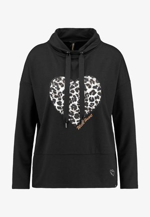 Felpa nera con un design a forma di cuore leopardato, dotata di lacci, vestibilità rilassata e accento ricamato "WildHeart".