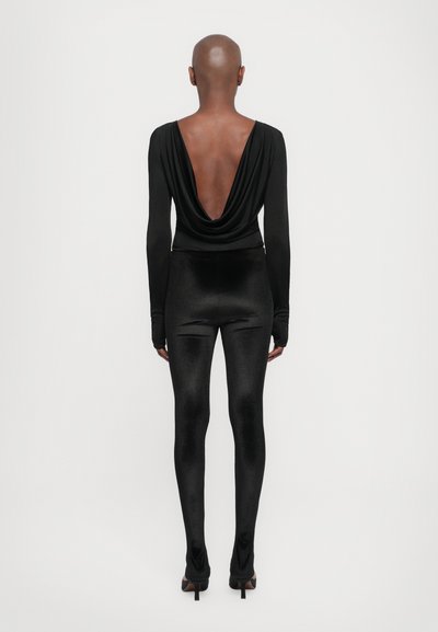 Black long-sleeve bodysuit with a deep back neckline paired with shiny black leggings, both featuring a smooth, stretchy fabric and fitted design.