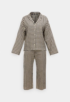 Rutig pyjamaset i beige och marinblått, bestående av en skjorta med knappar och långa ärmar samt matchande byxor med vida ben. Mjuk tygstruktur.