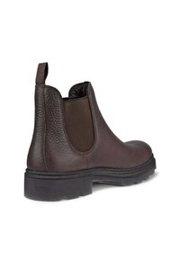 Bottes de cheville en cuir marron avec des panneaux latéraux élastiques, une finition texturée, un talon renforcé et des semelles en caoutchouc durable avec un motif de crampons.