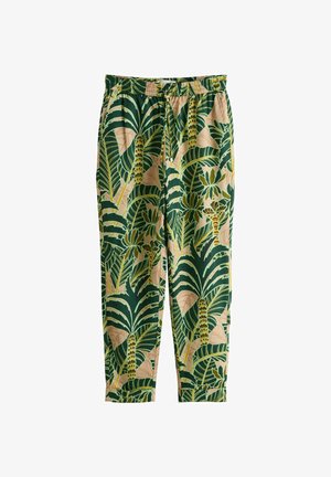 Helebeežid püksid rohelise ja kollase troopiliste palmilehtede trükiga, elastse vöökohaga ja kitsenevate sääreotstega.