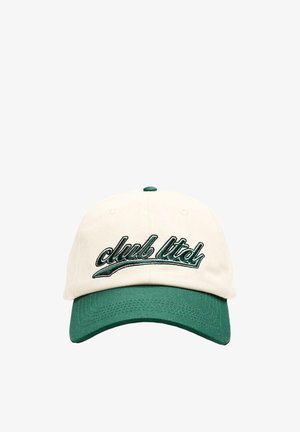 Baseball cap with green brim and cream crown, featuring green embroidered text "club ltd." on the front.