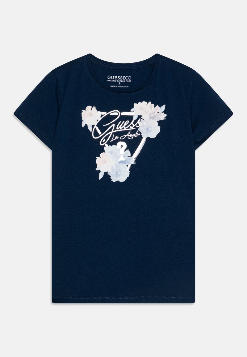Navy blue puuvillatee, jossa on kukkakuvio ja valkoiset tekstit "Guess Los Angeles". Lyhyet hihat ja pyöreä kaula-aukko.