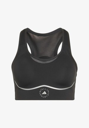 Black sports bra with racerback mesh panel, reflective silver curve detail, and circular Adidas by Stella McCartney logo on front center.