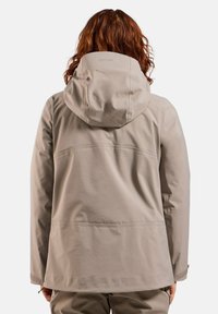 Light beige waterproof jacket with a hood, showing smooth texture and simple design. Features seam detailing and adjustable hem.