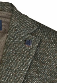 Groene tweed blazer van gestructureerde stof, met een notch lapel en een kleine zwarte speld met een logo aan de linkerkant.