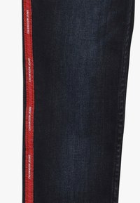 Calvin Klein Jeans SKINNY MR LOGO TAPE INKY STRETCH - Jeans Skinny Fit - denim