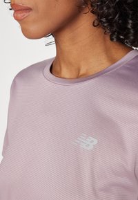 New Balance ESSENTIALS - T-skjorte til trening - ice wine