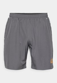 Gray athletic shorts with an elastic waistband, featuring side pockets and a small logo in orange on the lower right. Smooth fabric texture.