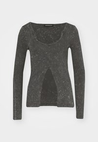 Long-sleeve top in dark gray, featuring a ribbed texture, a scoop neckline, and a front cutout detail. Soft, casual fabric.