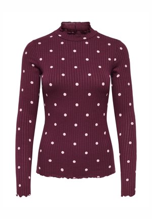 Bordeauxkleurige geribde top met lange mouwen, hoge hals en verspreide witte polka dots. Gedetailleerd met een geschulpte zoom en manchetten voor een textuureffect.