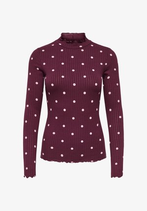 Bordeauxkleurige geribde top met lange mouwen, hoge hals en verspreide witte polka dots. Gedetailleerd met een geschulpte zoom en manchetten voor een textuureffect.
