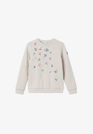 Sweatshirt beige à manches longues avec des fleurs brodées en rose, bleu et jaune dispersées sur le devant. Poignets et ourlet côtelés.