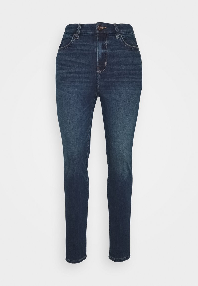 Dark blue high-waisted jeans made of denim. Features a fitted design, five pockets, and subtle whiskering on the front.