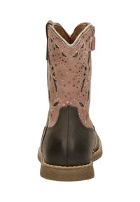 Pink suede ankle boot with cut-out detailing, dark brown leather heel, textured sole, and a scalloped top edge.