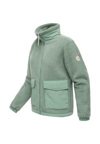 Giacca in felpa verde chiaro con colletto alto, zip frontale, due ampie tasche a soffietto trapuntate, polsini elasticizzati e toppa rotonda sulla manica.