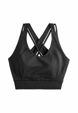 Svart sportbh med korsade axelremmar, tillverkad av ett slätt och elastiskt material med formade kupor och ett brett elastiskt band.
