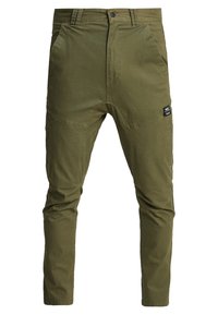Olivově zelené slim-fit kalhoty vyrobené z bavlny, s předními kapsami, zipovým zapínáním a malou nášivkou loga na levém stehně.