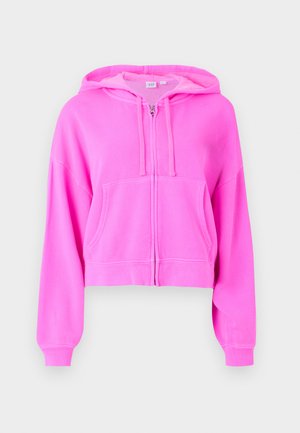 Sweat à capuche cropped rose en tissu doux avec fermeture éclair à l'avant, deux poches avant, cordon de serrage à la capuche et poignets côtelés.