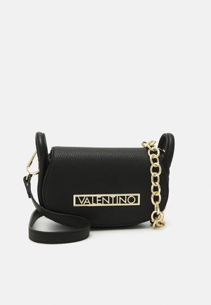 Black leather crossbody bag featuring a textured surface, gold hardware, and a thick chain accent. Rectangle shape with adjustable strap.