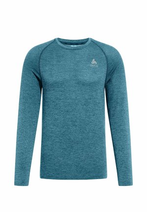 Long-sleeve athletic shirt in textured teal fabric with a crew neckline. Features raglan sleeves and a small logo on the chest.