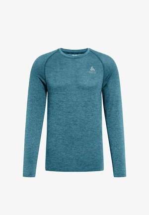 Long-sleeve athletic shirt in textured teal fabric with a crew neckline. Features raglan sleeves and a small logo on the chest.