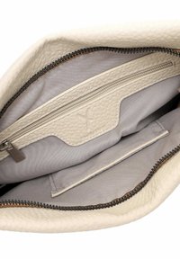 Beige textured leather bag interior featuring a zippered pocket and a smooth gray lining, with a black zipper detail along the edge.