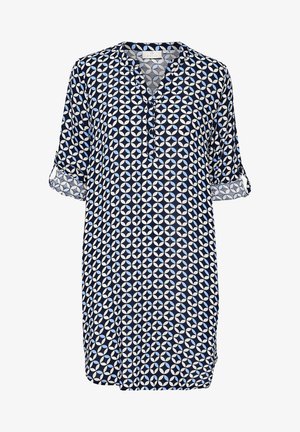 Tumedat bluus valgete geomeetriliste mustritega, kerge kangaga, lühikeste varrukatega, rullitud mansettidega, V-kaelusega ja nööbiga detailiga.