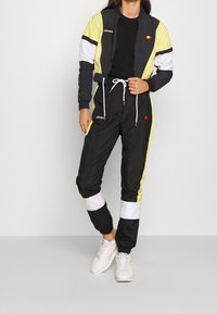 Ellesse Tracksuit bottoms - black